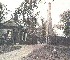 The Queen Anne Lodge with the Queen Anne obelisk in the background.  Date of picture unknown, possibly late victorian?